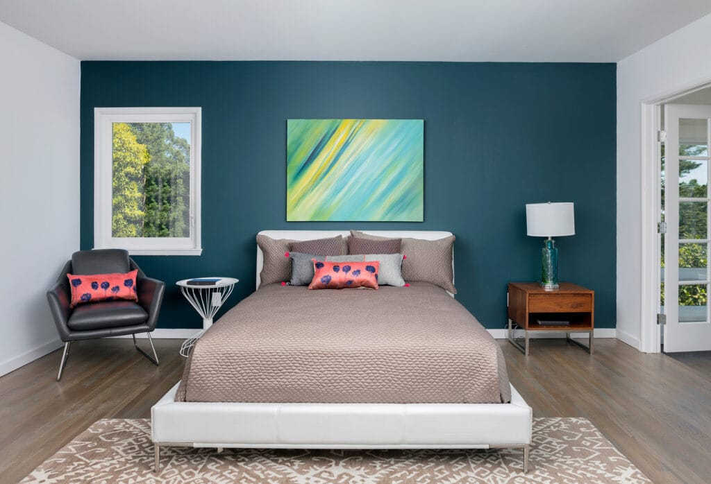 Laminate flooring in the bedroom area with a night stand by Flooring 101 Oxnard, CA - Ventura, CA - Bakersfield, CA - Goleta, CA - Thousand Oaks, CA - Santa Maria, CA - Simi Valley, CA.